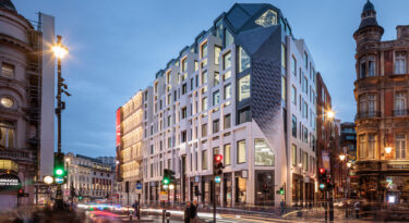 A new 144,000 sq. ft. building has taken shape behind the iconic Piccadilly Lights