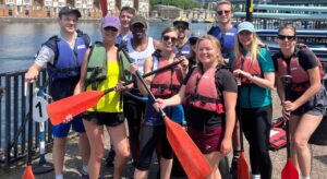 Dragon boat racers with paddles