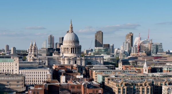 The London skyline featuring London St Paul's Cathedral and other buildings on a sunny day