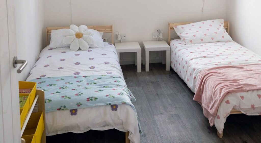 modular housing demonstrator bedroom with twin beds