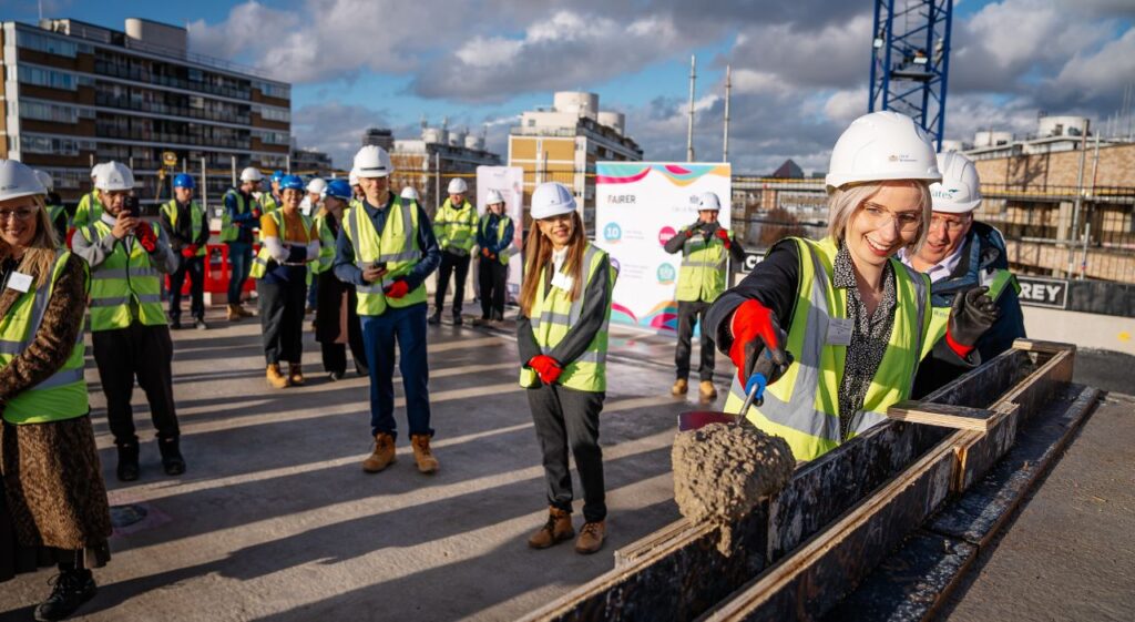 Westminster Balmoral House topping out shovelling