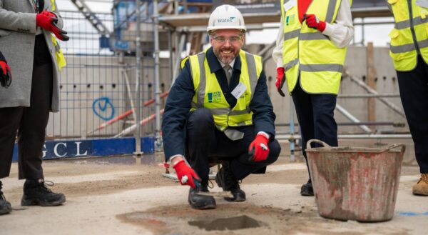 Zephaniah House topping out Wates manager smiling