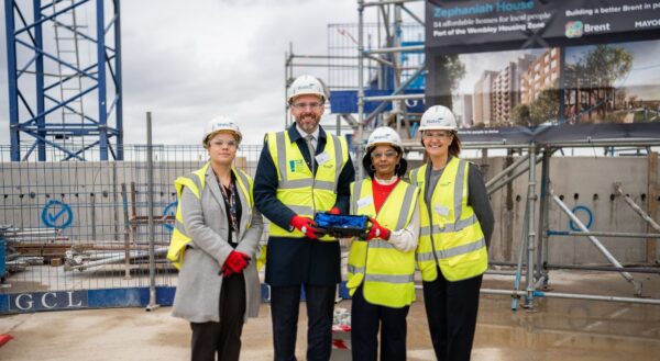 Zephaniah House topping out people posing