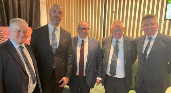 Mark Craig and senior team members posing