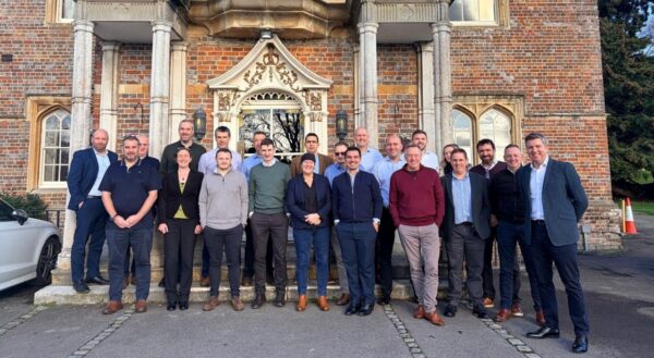 Mark Craig and the Construction team posing outside a heritage site