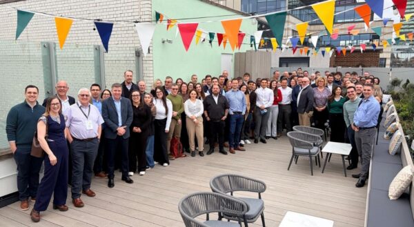 Wates Construction team smiling and posing on the outside terrace