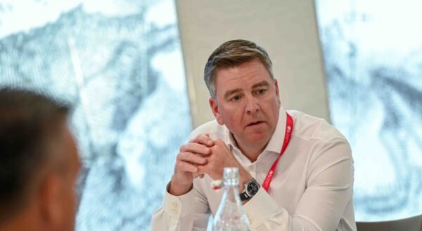 Mark Craig chatting at a roundtable